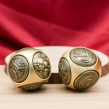 Activate prosperity energy with this brass Feng Shui spinning ball, a portable talisman for good luck and abundance.