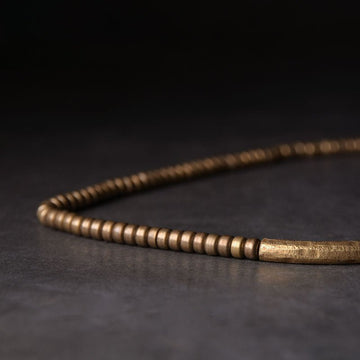Brass mala beads and charm on the protection bracelet