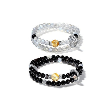 Double wrap bracelet made of gray moonstone for intuition and black onyx for protection.