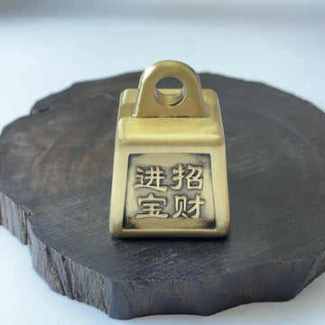 Solid brass Feng Shui money weight, a spinning desk ornament for attracting wealth and good fortune.
