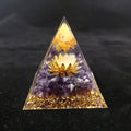 White sphere and amethyst crystal pyramid for clarity and spiritual connection.