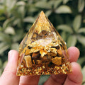 Clear quartz pyramid with large leaf inclusion for connecting with nature's energy.