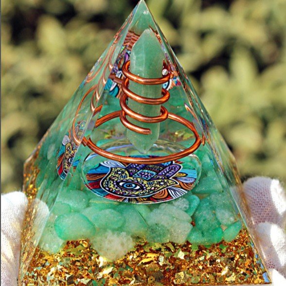 Green Aventurine crystal point pyramid for attracting prosperity and heart chakra healing.
