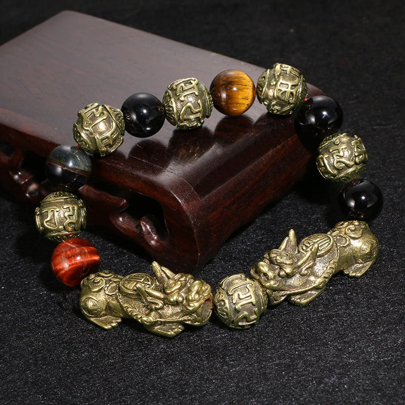 Pi Yao Wealth Bracelet made of black obsidian, featuring the Om Mani Padme Hum mantra for protection and abundance.