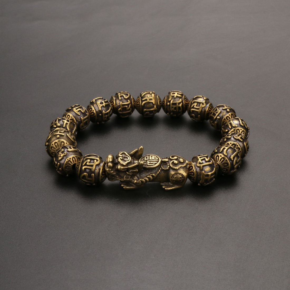Pi Yao wealth bracelet for men with Om Mani Padme Hum and brass mala beads for protection.