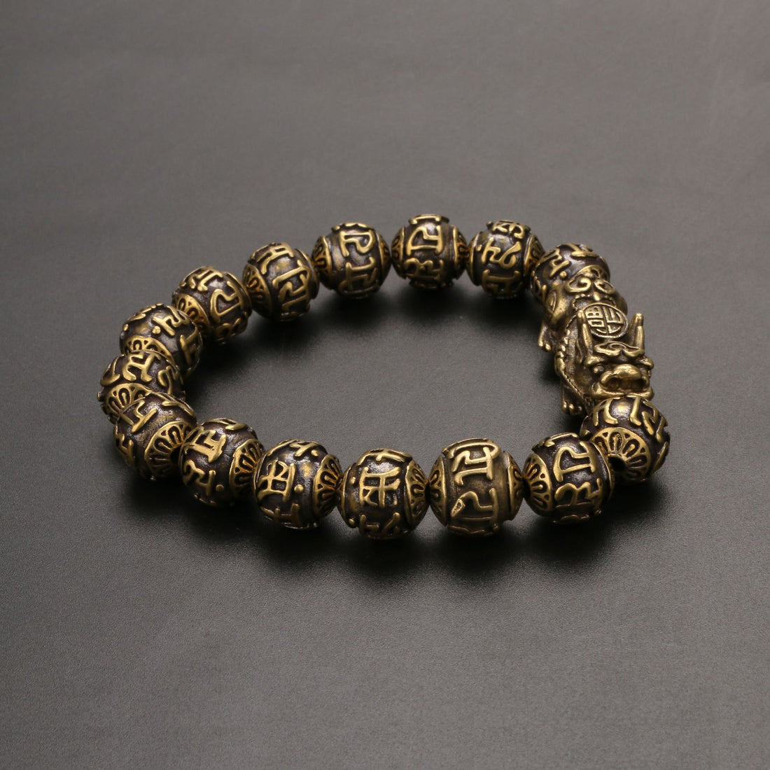 Pi Yao wealth bracelet for men with Om Mani Padme Hum and brass mala beads for protection.