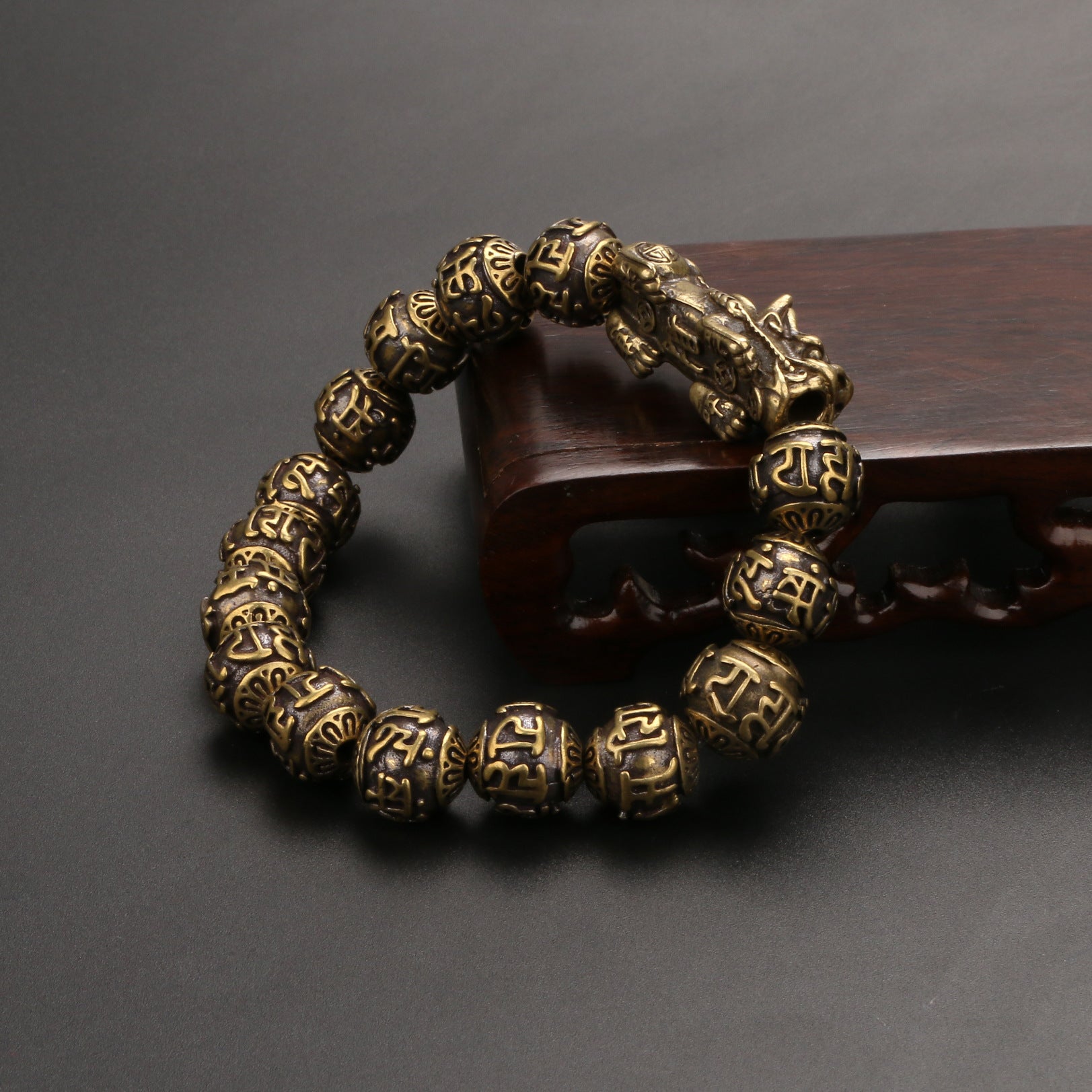 A spiritual bracelet combining the Pi Yao money attractor with the sacred Om Mani Padme Hum mantra.