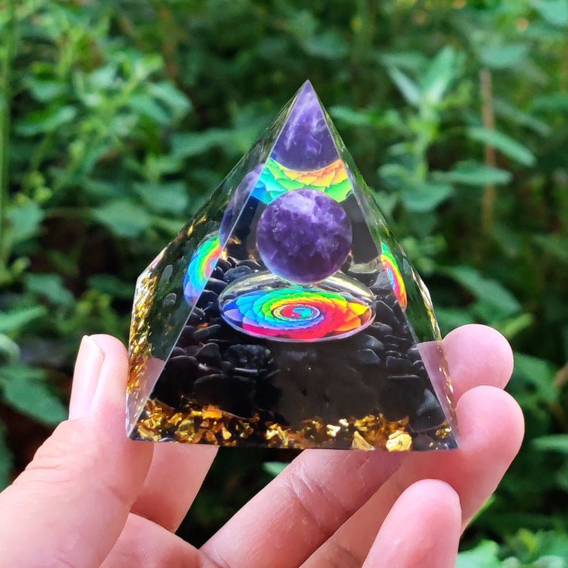 crystal energy pyramid with sun gear design for meditation and chakra balancing.