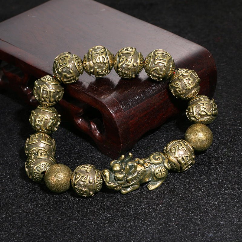 Pi Yao Wealth Bracelet made of black obsidian, featuring the Om Mani Padme Hum mantra for protection and abundance.