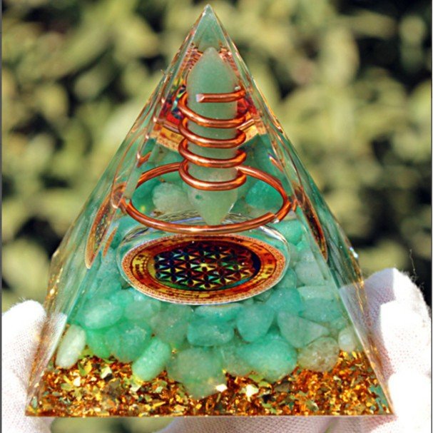 Green Aventurine crystal point pyramid for attracting opportunities and good luck.