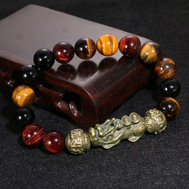 Pi Yao and Om Mani Padme Hum black obsidian bracelet worn on wrist for protection and attracting wealth.