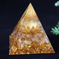 Citrine and lotus crystal pyramid for abundance, creativity, and solar plexus energy.