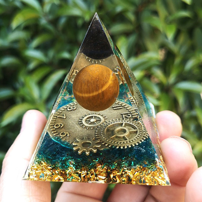 Glass crystal pyramid with clock motif for decorative focus and energy cleansing.