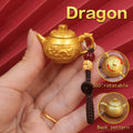 Personalized Dragon Zodiac keychain with spinning teapot, a powerful charm for ambition, success, and magical energy.