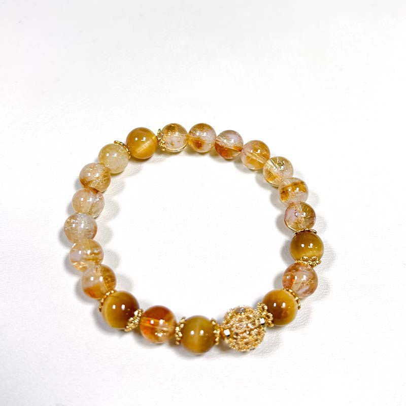 Wrap yourself in abundance with this protective double strand bracelet of Tiger's Eye and Citrine.