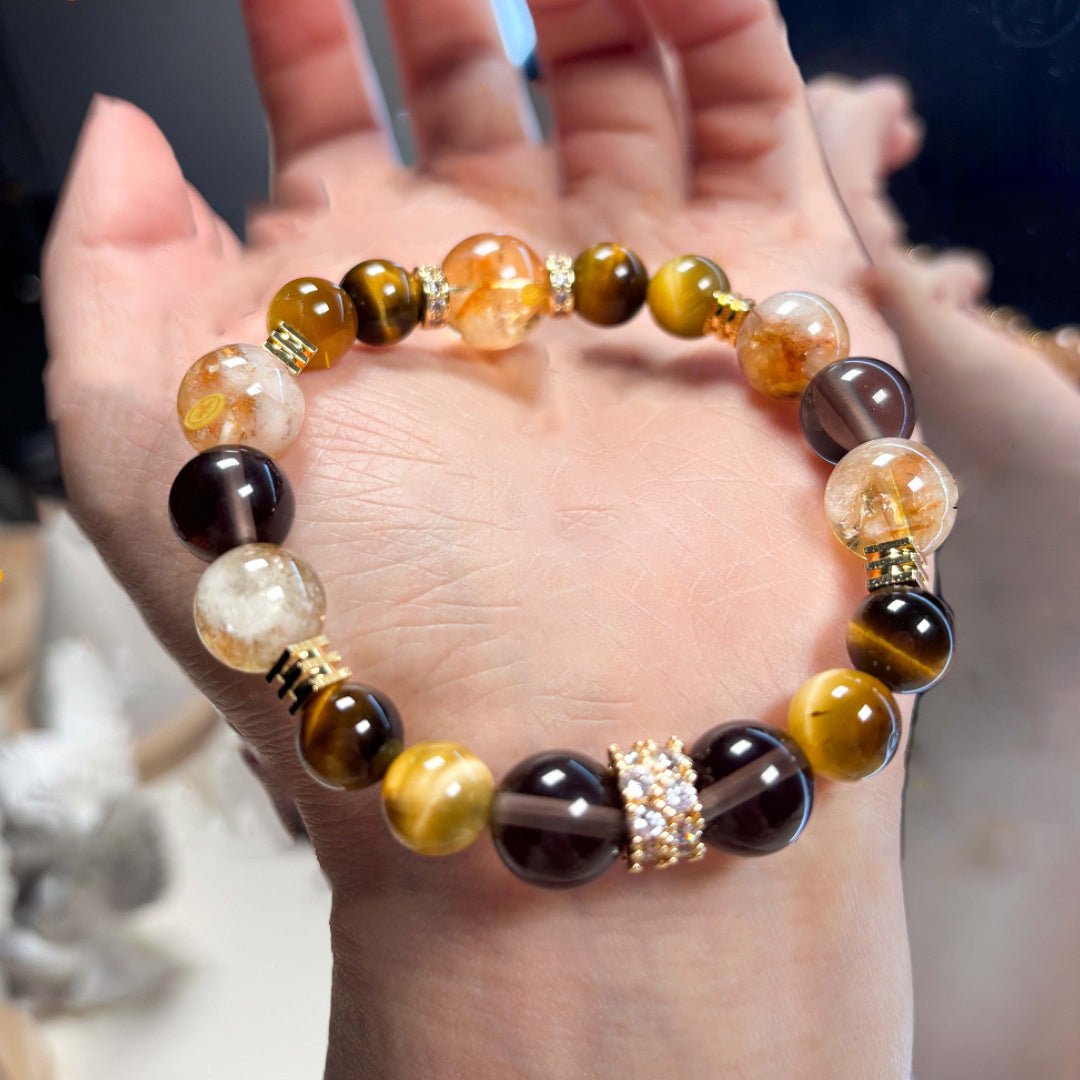 Double wrap Tiger's Eye and Citrine bracelet worn on wrist, a powerful talisman for daily manifestation.