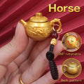 Personalized Horse Zodiac keychain with spinning teapot, a charm for freedom, success in travels, and boundless energy.