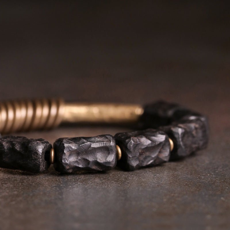 Unisex bracelet made of dark ebony wood beads and brass