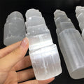 An elegant Natural Moroccan Selenite energy obelisk, the perfect gift for spiritual wellness and creating a peaceful home environment.