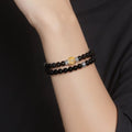 Styling the protection and intuition bracelet stacked with other jewelry for a bohemian look.
