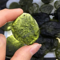 Powerful energy transformation tool: a raw Moldavite pendant from the Czech Republic on a sleek necklace for spiritual growth.