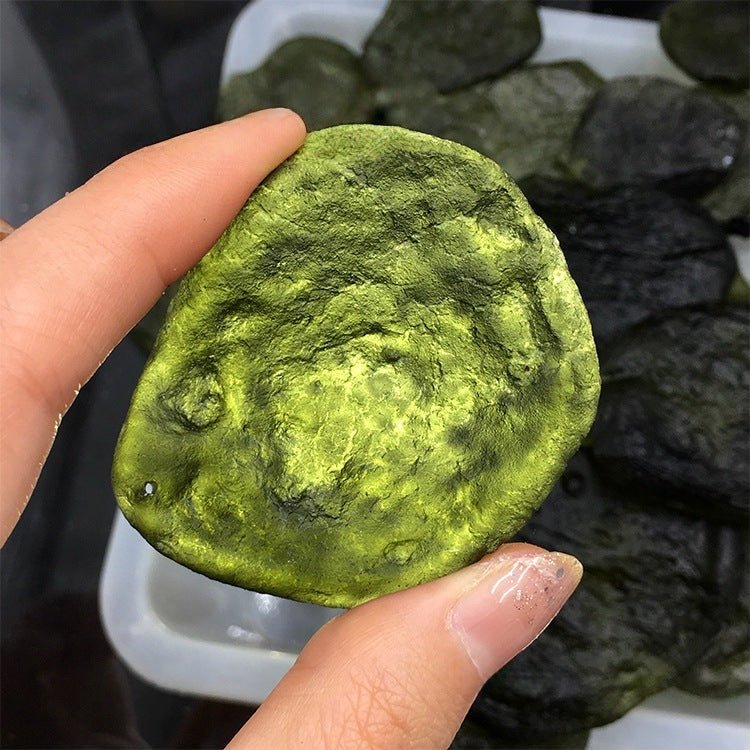 Powerful energy transformation tool: a raw Moldavite pendant from the Czech Republic on a sleek necklace for spiritual growth.