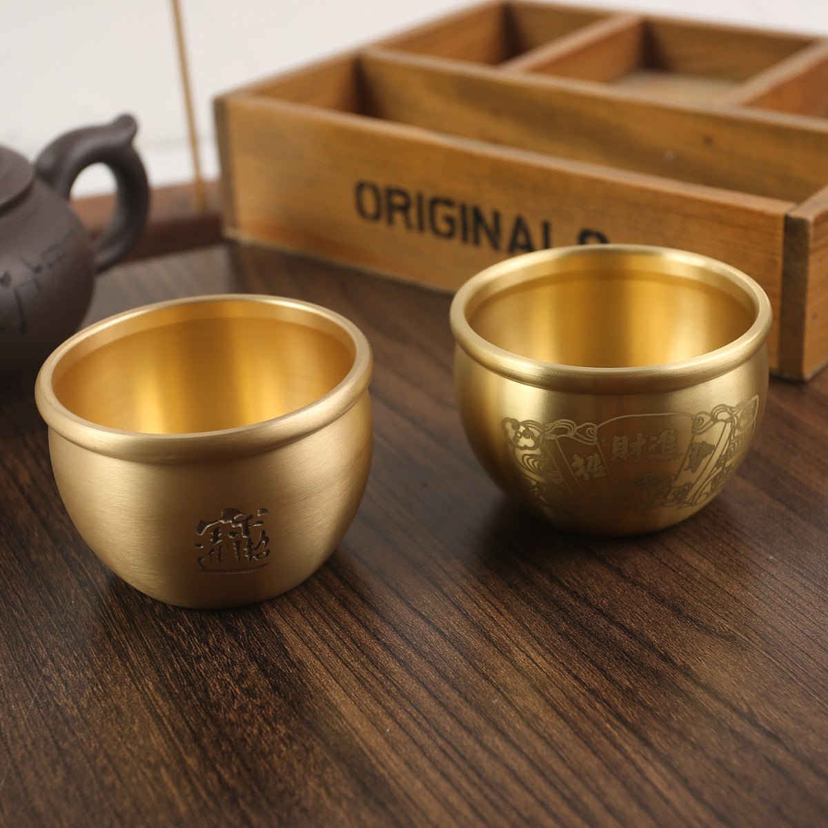 An elegant brass Feng Shui jar for wealth, doubling as a meaningful decor piece to enhance the energy of any space.