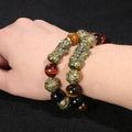 Symbol of protection and abundance: the Pi Yao wealth bracelet in black obsidian and sacred mantra.