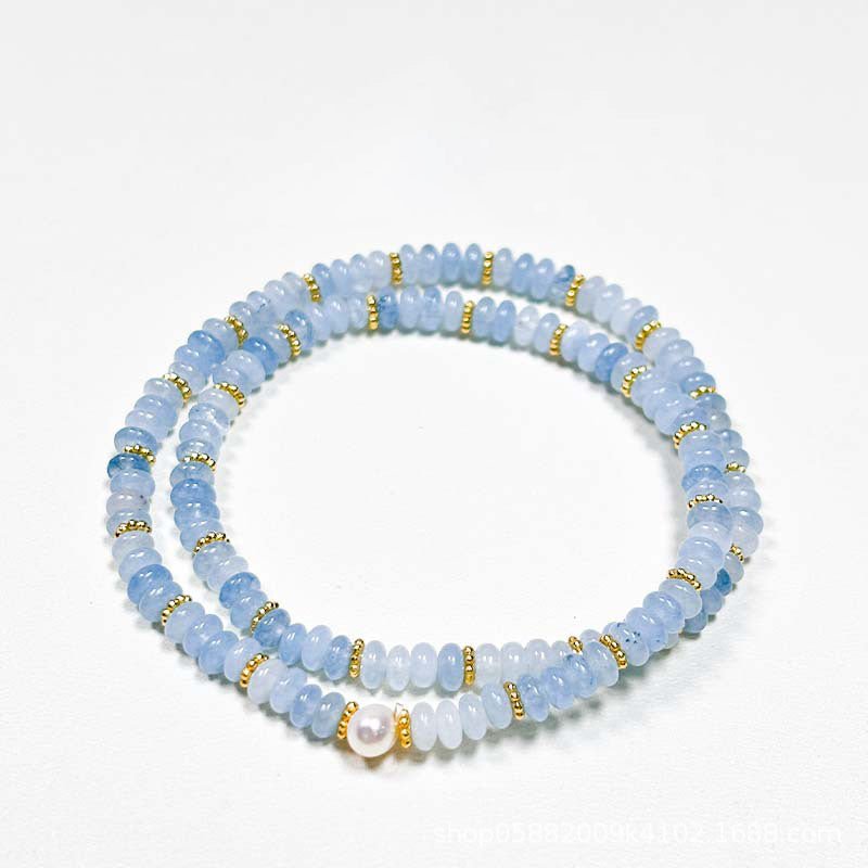 Double wrap bracelet with baroque pearls, crystals, rose quartz for love, and aquamarine for communication.