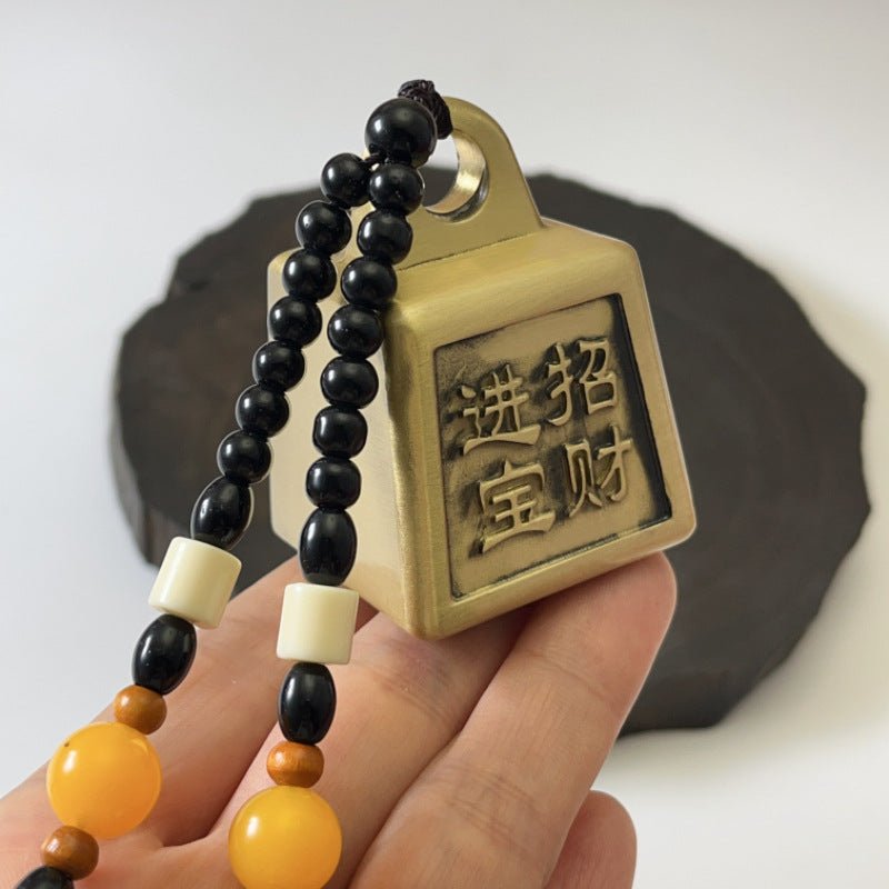 Brass Feng Shui ornament for desk, symbolizing the accumulation of wealth and prosperity.

