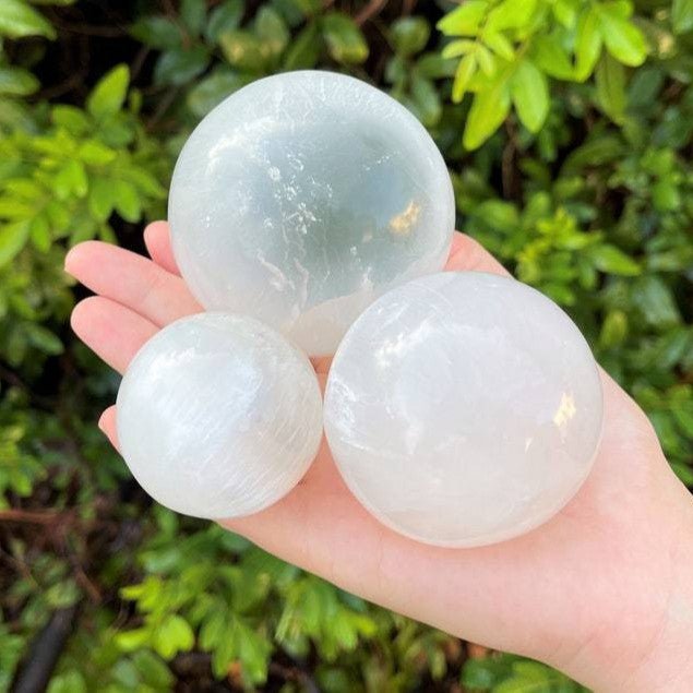 Natural Moroccan Selenite Sphere, a crystal ball for energy cleansing, deep meditation, and Reiki healing practices.