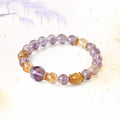 Natural crystal point bracelet for stacking, combining Amethyst for intuition and Citrine for wealth.