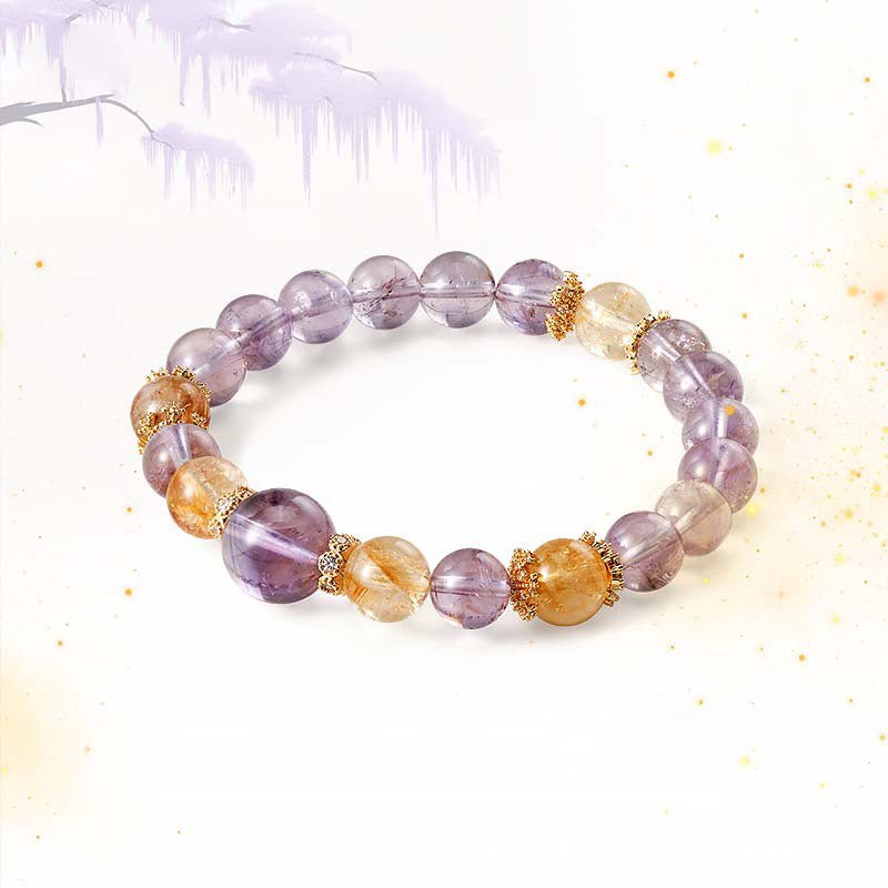 Natural crystal point bracelet for stacking, combining Amethyst for intuition and Citrine for wealth.