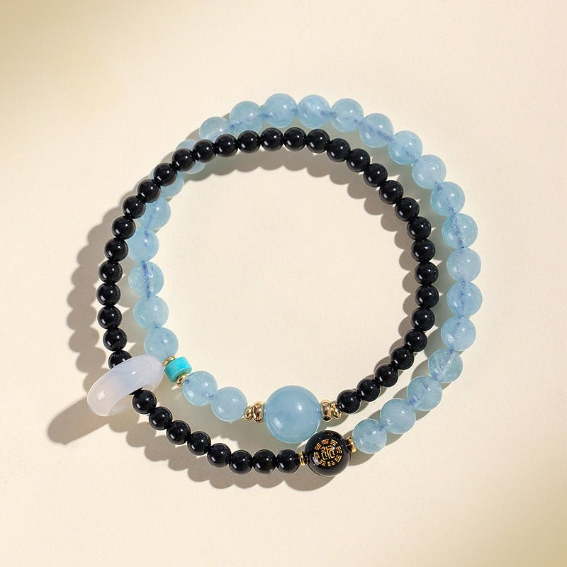 Blue lace agate or aquamarine bead embodying the Water element for flow and intuition.