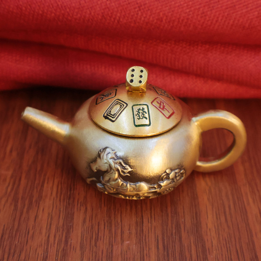 Brass Spinning Teapot fidget toy, an "Instant Win" Mahjong-themed good luck charm for gamers.