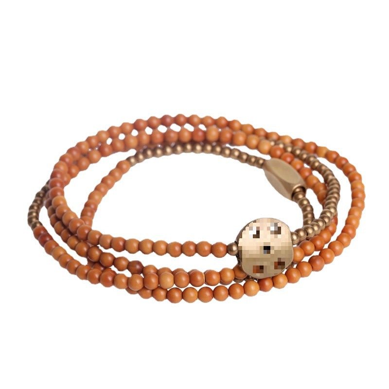 Intricate brass charm on the boho spiritual bracelet