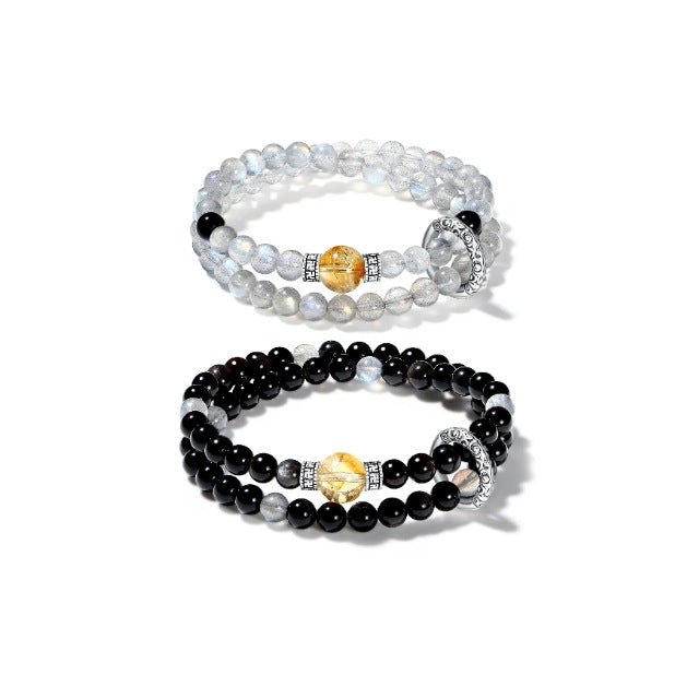 Double wrap bracelet made of gray moonstone for intuition and black onyx for protection.