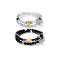 Double wrap bracelet made of gray moonstone for intuition and black onyx for protection.