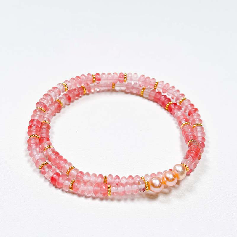 Double wrap bracelet with baroque pearls, crystals, rose quartz for love, and aquamarine for communication.