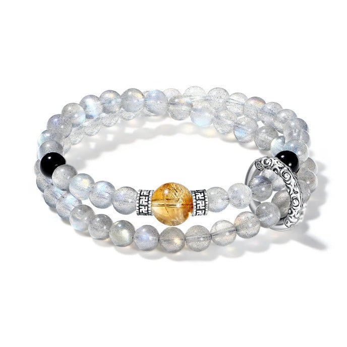 Double wrap bracelet made of gray moonstone for intuition and black onyx for protection.