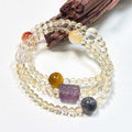 Close-up of the crystal details on the choker: Yellow Aura Quartz, Black Rutilated Quartz, and Tiger's Eye for protection.