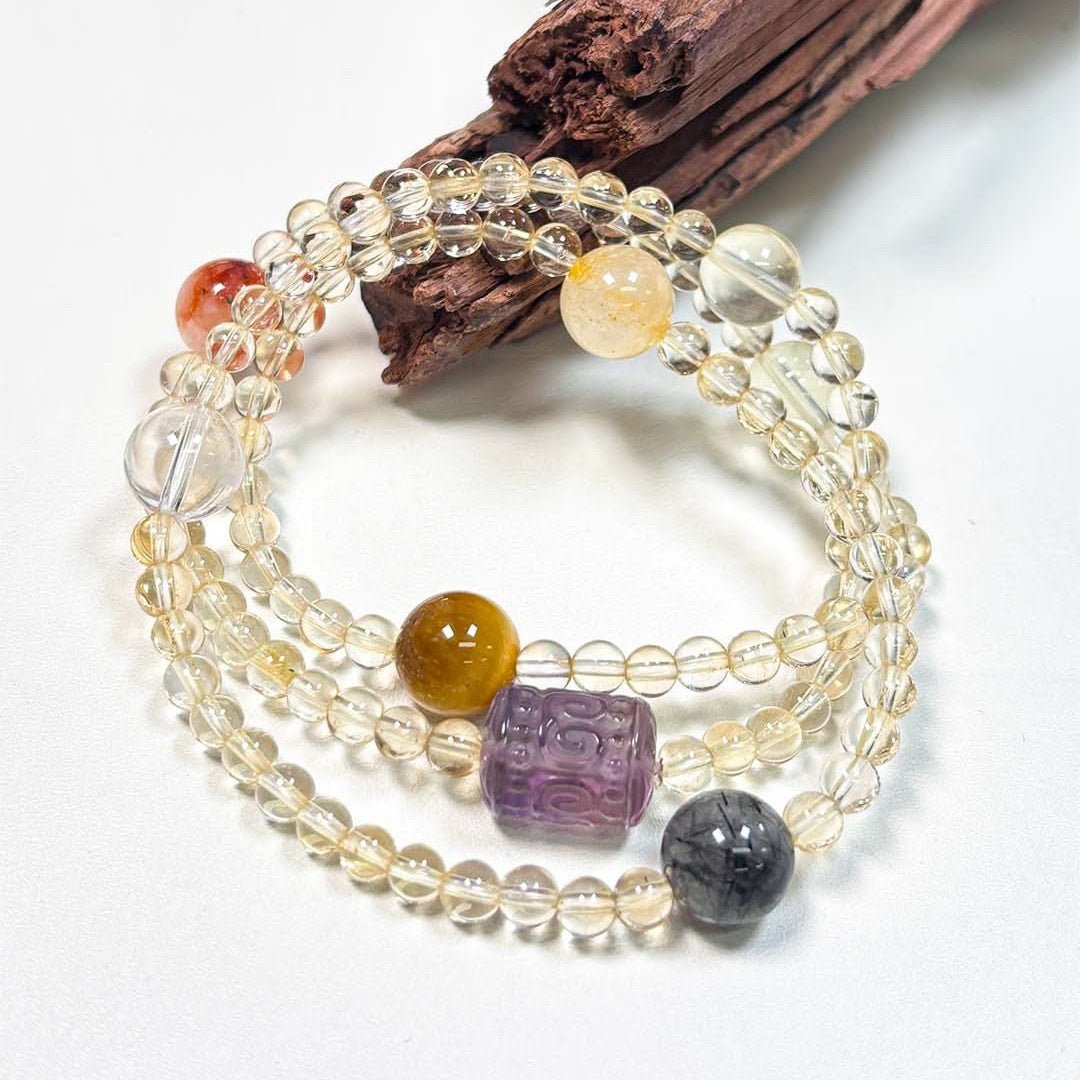 Close-up of the crystal details on the choker: Yellow Aura Quartz, Black Rutilated Quartz, and Tiger's Eye for protection.