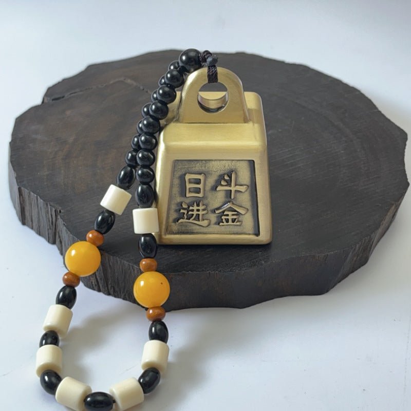 Solid brass Feng Shui money weight, a spinning desk ornament for attracting wealth and good fortune.