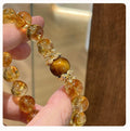 Wealth Manifestation Bracelet with Tiger's Eye and Citrine stones for attracting abundance and success.