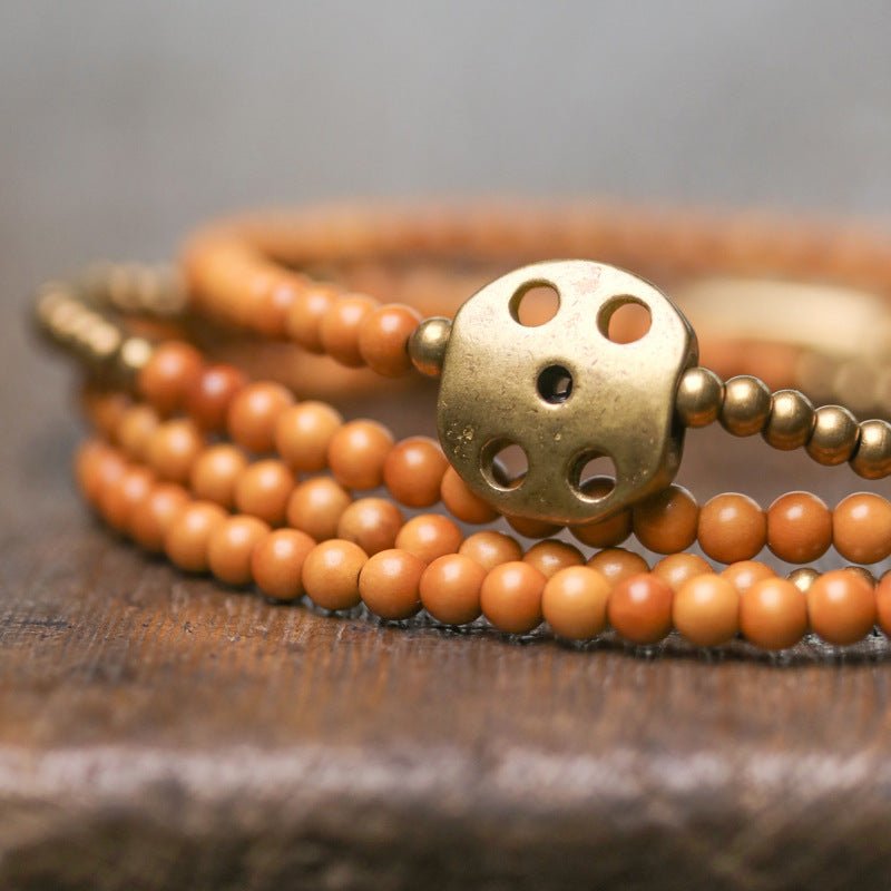 Intricate brass charm on the boho spiritual bracelet