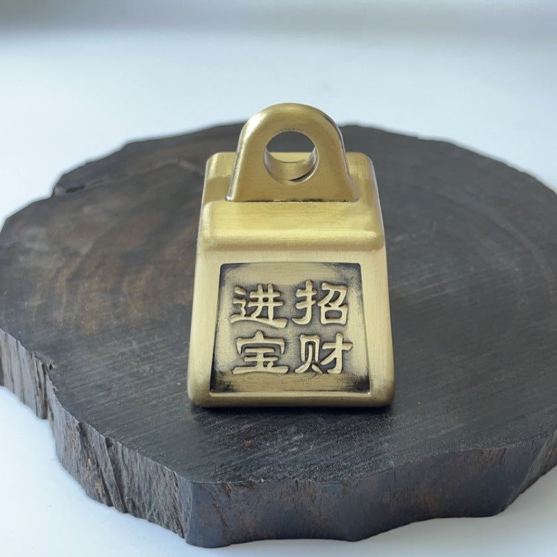 Solid brass Feng Shui money weight, a spinning desk ornament for attracting wealth and good fortune.