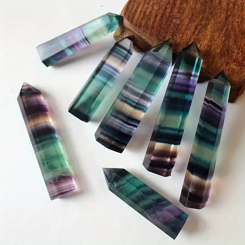 Natural Rainbow Fluorite Point, a single terminated generator crystal for energy healing and chakra balancing.