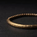 Smooth, polished surface of the handmade copper bracelet
