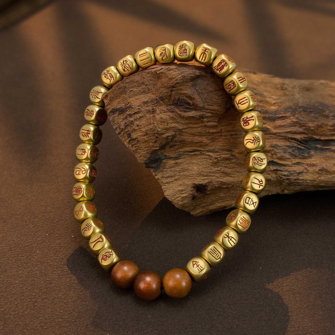 Taoist Golden Light Mantra protection bracelet with an engraved copper talisman for positive energy.