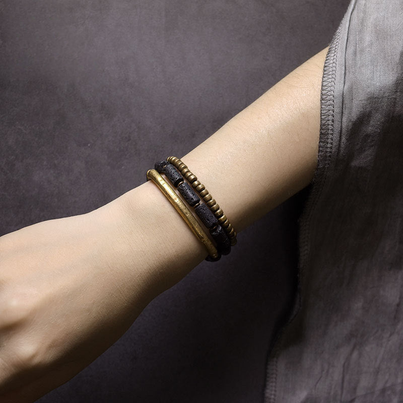 Brass mala beads and charm on the protection bracelet